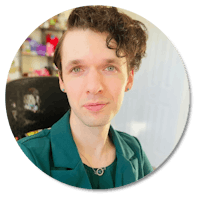 a man with curly hair in a green jacket